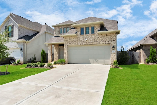 view of front of home featuring fence, a front lawn, driveway, and brick siding