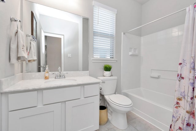 bathroom with shower / bath combo, toilet, vanity, and tile patterned floors