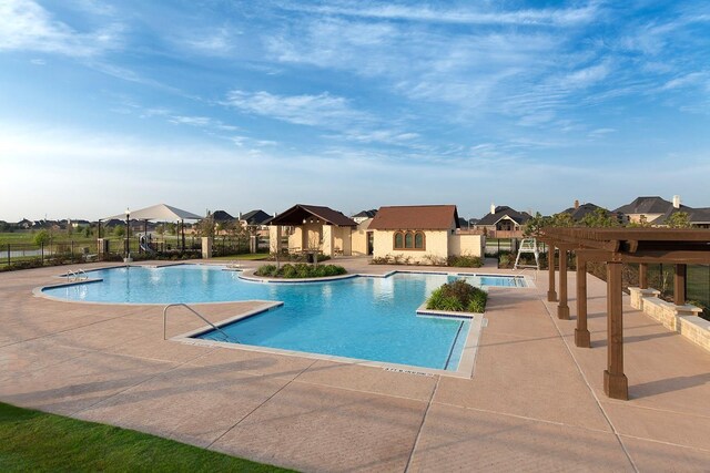 pool featuring a pergola, a gazebo, fence, a patio, and a residential view