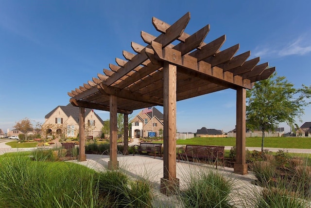 view of patio / terrace featuring a pergola and a residential view