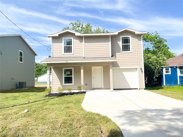 304 N Orange St, Sweeny, TX 77480 - traditional home with central AC unit, an attached garage, a front lawn, a porch, and driveway
