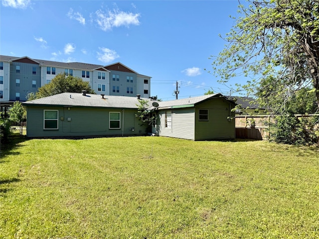 1813 W 15th St, Houston, TX 77008 - back of property with fence and a lawn