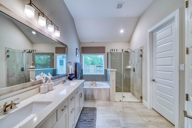 full bath featuring lofted ceiling, visible vents, a stall shower, and a sink