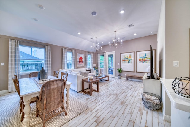 dining room featuring an inviting chandelier, a healthy amount of sunlight, and baseboards