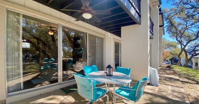 view of patio / terrace featuring outdoor dining area and a ceiling fan