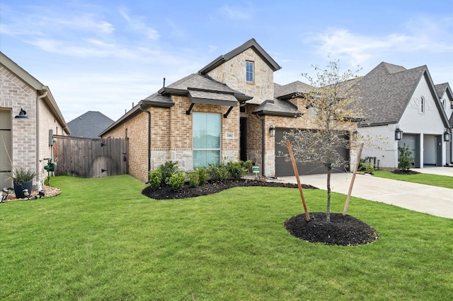 20806 Gray Percheron Ln, Tomball, TX 77377 - french country home featuring stone siding, concrete driveway, brick siding, a shingled roof, and a garage