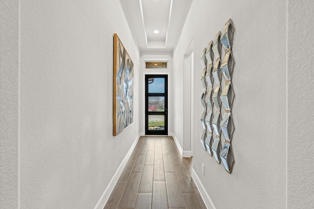 hallway featuring recessed lighting, baseboards, and dark wood-style floors