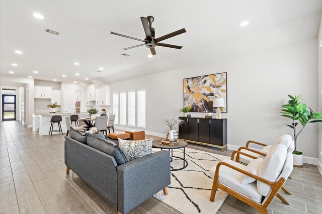 20806 Gray Percheron Ln, Tomball, TX 77377 - living area featuring ceiling fan, light wood-style flooring, and recessed lighting