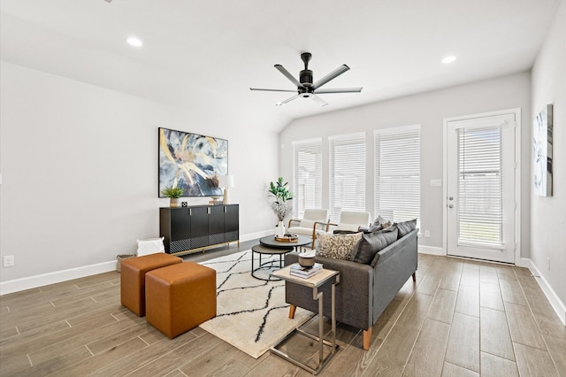 living room with baseboards, a ceiling fan, wood finished floors, and recessed lighting
