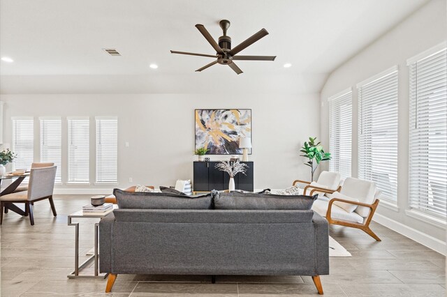 living area featuring a ceiling fan, light wood-style floors, visible vents, and recessed lighting
