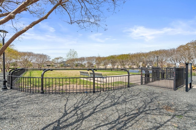 exterior space with a lawn and fence