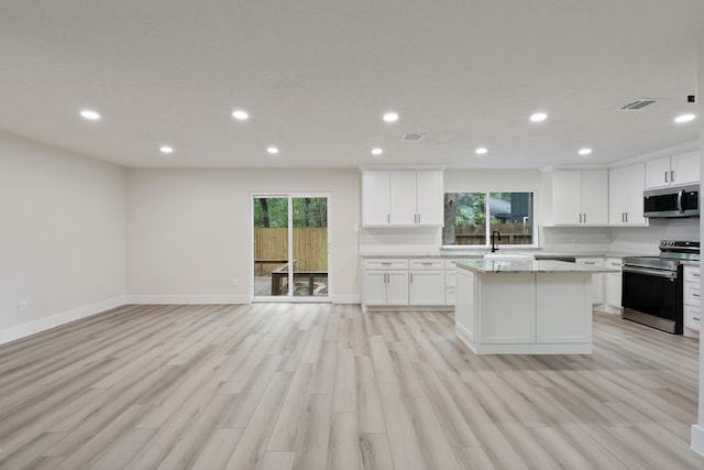 kitchen with visible vents, recessed lighting, a wealth of natural light, and stainless steel appliances