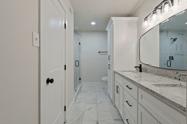 bathroom with double vanity, a stall shower, a sink, marble finish floor, and recessed lighting