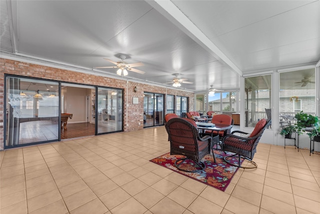 466 Buffalo Ct, Livingston, TX 77351 - sunroom with brick wall and tile patterned flooring