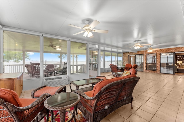 466 Buffalo Ct, Livingston, TX 77351 - sunroom / solarium featuring outdoor dining space, tile patterned flooring, a wall unit AC, and ceiling fan