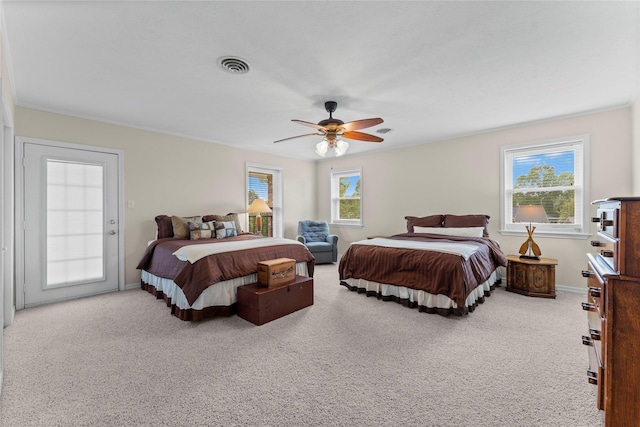 466 Buffalo Ct, Livingston, TX 77351 - bedroom with ceiling fan, carpet floors, multiple windows, and visible vents