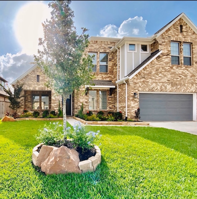 view of front of house with concrete driveway, a front yard, and a garage