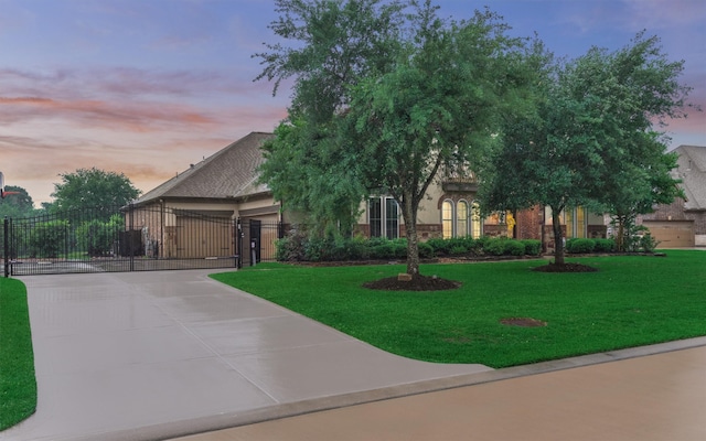 21603 Fairhaven Creek Dr, Cypress, TX 77433 - obstructed view of property featuring a gate, a lawn, and driveway
