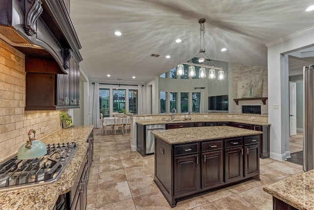 21603 Fairhaven Creek Dr, Cypress, TX 77433 - kitchen featuring appliances with stainless steel finishes, a sink, custom exhaust hood, a kitchen island, and tasteful backsplash