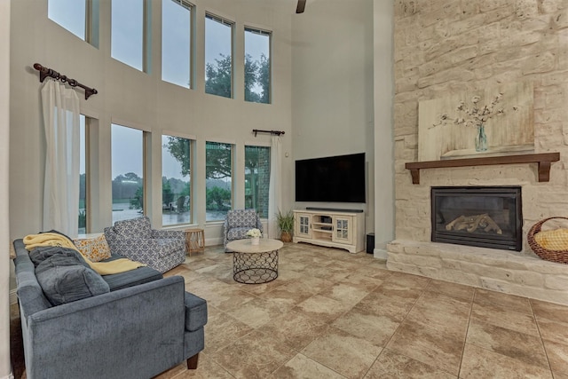 21603 Fairhaven Creek Dr, Cypress, TX 77433 - living room with a high ceiling, plenty of natural light, and a stone fireplace