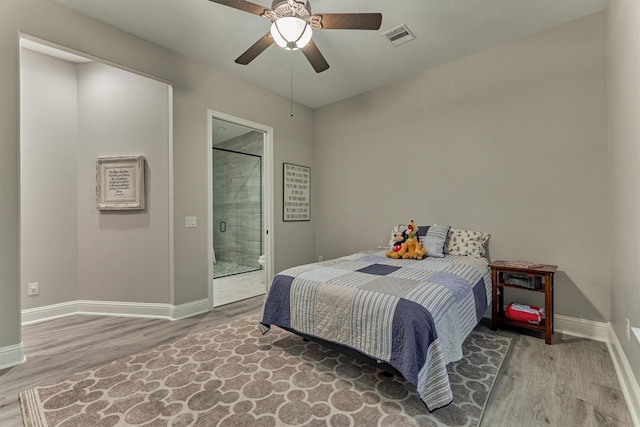 21603 Fairhaven Creek Dr, Cypress, TX 77433 - bedroom with wood finished floors, baseboards, and a ceiling fan