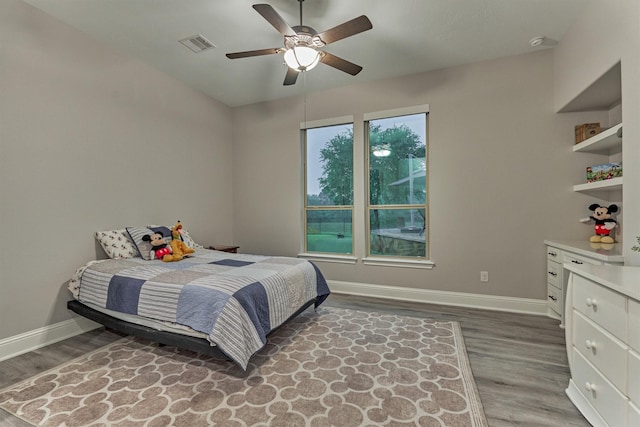 21603 Fairhaven Creek Dr, Cypress, TX 77433 - bedroom featuring wood finished floors, baseboards, and ceiling fan