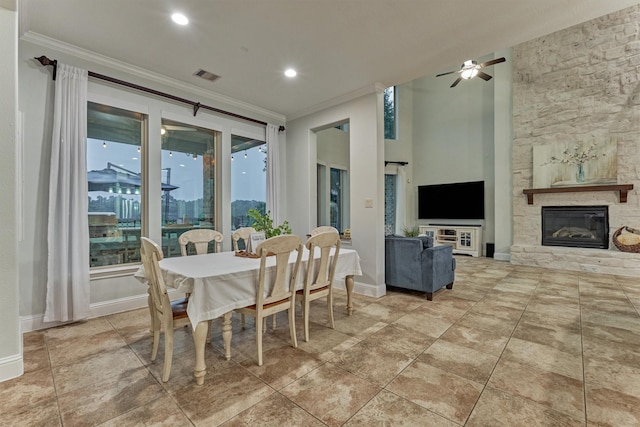 21603 Fairhaven Creek Dr, Cypress, TX 77433 - dining area featuring ornamental molding, a ceiling fan, a stone fireplace, recessed lighting, and baseboards