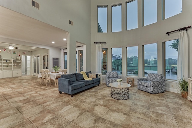 21603 Fairhaven Creek Dr, Cypress, TX 77433 - living area featuring ceiling fan and a high ceiling