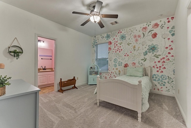 21603 Fairhaven Creek Dr, Cypress, TX 77433 - bedroom featuring light colored carpet, ensuite bathroom, baseboards, a ceiling fan, and a sink