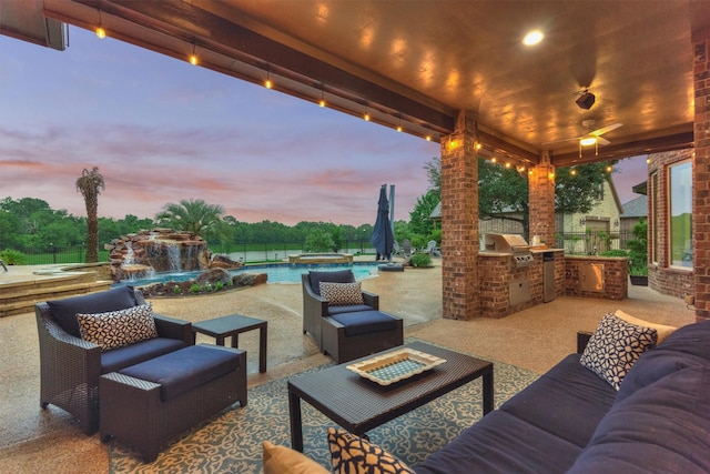 21603 Fairhaven Creek Dr, Cypress, TX 77433 - patio terrace at dusk featuring an outdoor living space, a pool with connected hot tub, and a patio