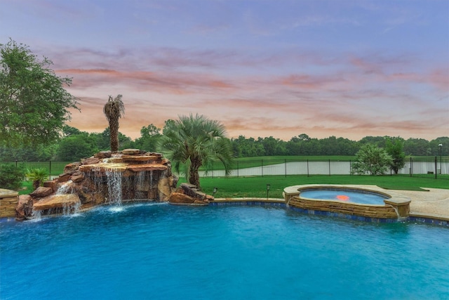 21603 Fairhaven Creek Dr, Cypress, TX 77433 - pool at dusk featuring a pool with connected hot tub