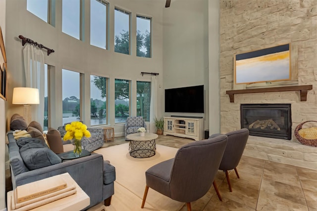 21603 Fairhaven Creek Dr, Cypress, TX 77433 - living room featuring a towering ceiling and a stone fireplace