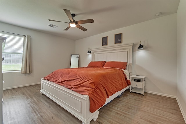 155 Pine Bend Ct, Magnolia, TX 77354 - bedroom featuring light wood-style floors, baseboards, and ceiling fan