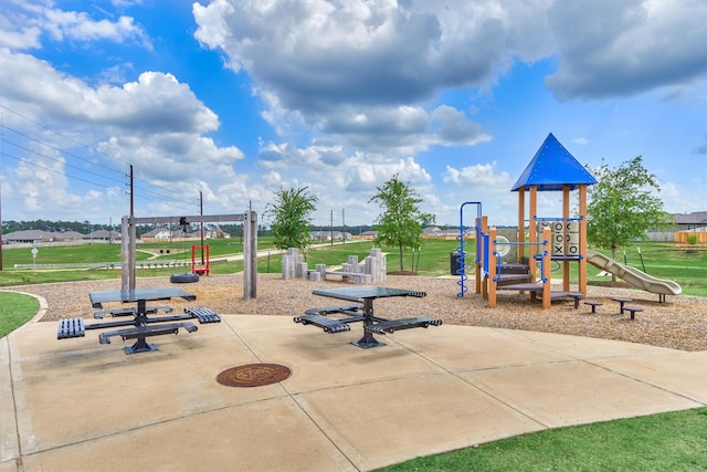community play area with a lawn