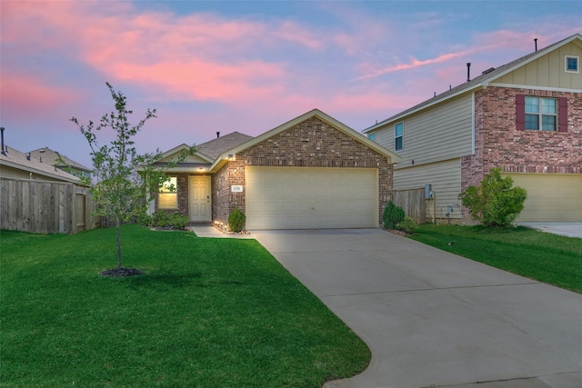 ranch-style house featuring concrete driveway, fence, brick siding, an attached garage, and a lawn