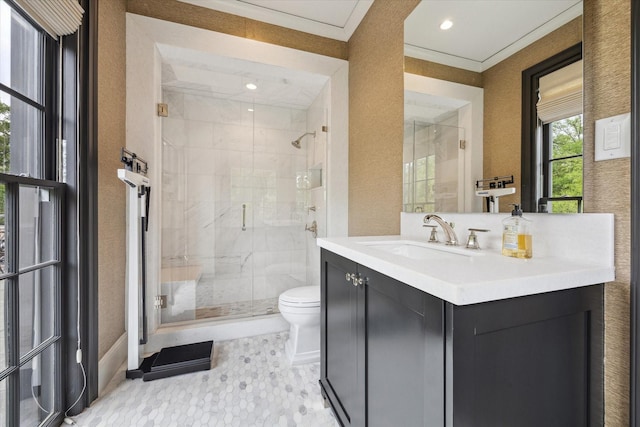 full bathroom with toilet, a textured wall, a shower stall, and vanity