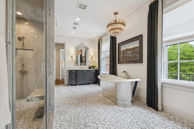 full bath featuring a shower stall, vanity, visible vents, a freestanding bath, and baseboards