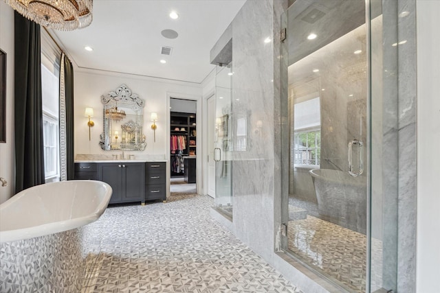 full bath with vanity, crown molding, a stall shower, visible vents, and a freestanding bath