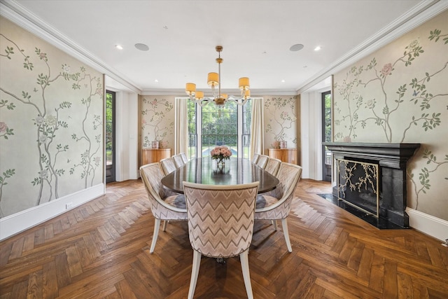 dining space with baseboards, wallpapered walls, ornamental molding, and an inviting chandelier