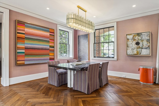 dining room with a healthy amount of sunlight, crown molding, and baseboards