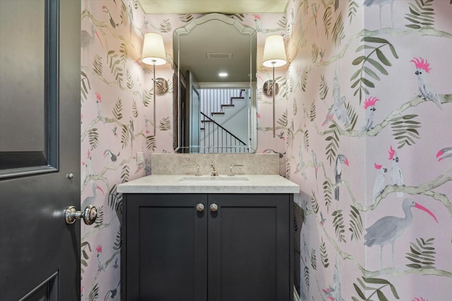 bathroom with visible vents and vanity