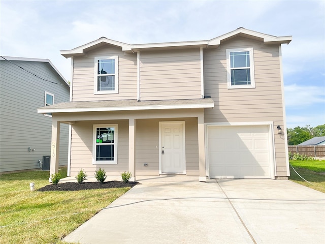 310 N Orange St, Sweeny, TX 77480 - view of front of property featuring a garage, a front yard, driveway, covered porch, and central AC unit