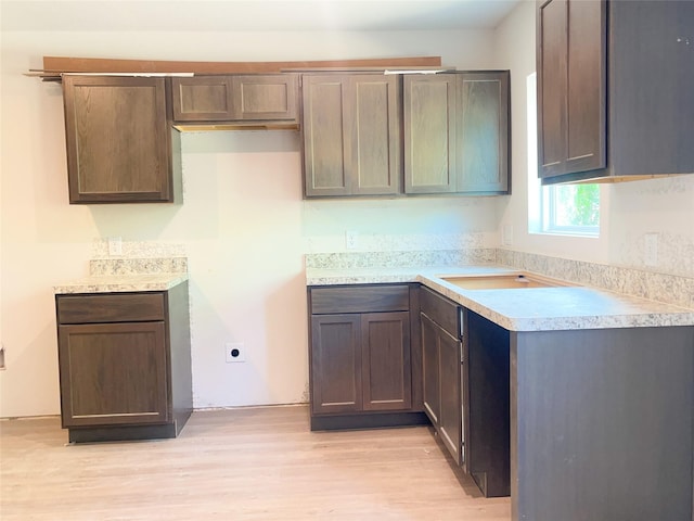 310 N Orange St, Sweeny, TX 77480 - kitchen featuring light wood-style flooring and light countertops