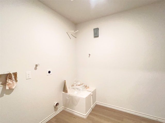 310 N Orange St, Sweeny, TX 77480 - laundry area with hookup for an electric dryer, light wood-style floors, and baseboards