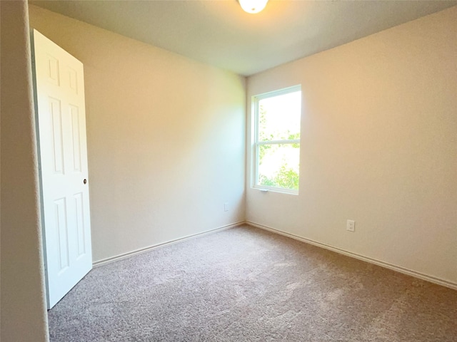310 N Orange St, Sweeny, TX 77480 - carpeted spare room featuring baseboards