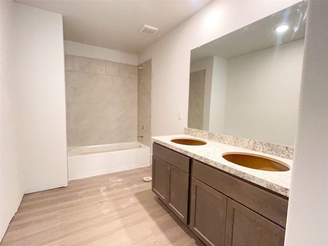 310 N Orange St, Sweeny, TX 77480 - full bath with wood finished floors, double vanity, and bathtub / shower combination