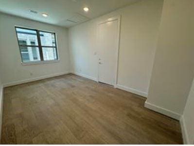 401 Wild Thicket Dr, Katy, TX 77493 - unfurnished room featuring wood finished floors and recessed lighting