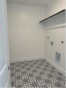 401 Wild Thicket Dr, Katy, TX 77493 - laundry room featuring hookup for an electric dryer and attic access