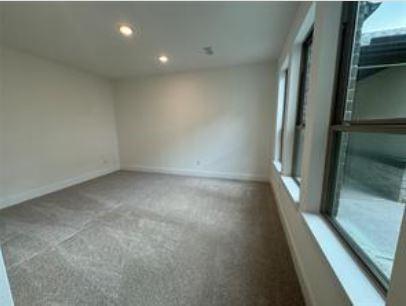 401 Wild Thicket Dr, Katy, TX 77493 - carpeted empty room with recessed lighting and baseboards