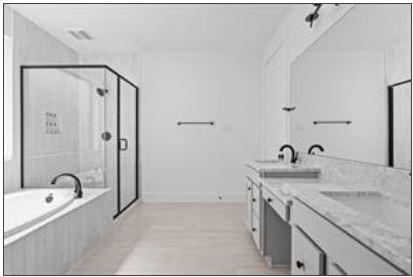 401 Wild Thicket Dr, Katy, TX 77493 - bathroom featuring a shower stall, a garden tub, and double vanity